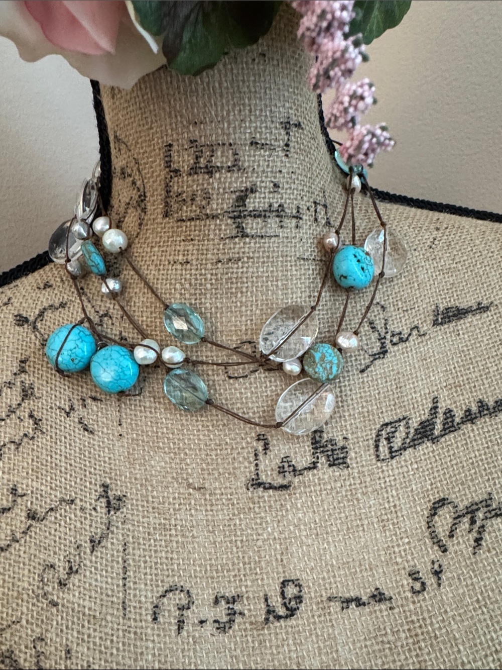 Turquoise, Pearl string necklace with blue and clear stones.